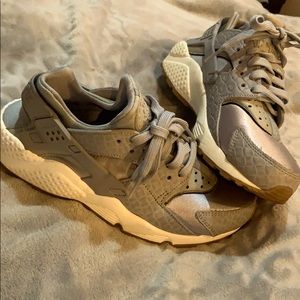 woman’s silver / gray huarache sneakers